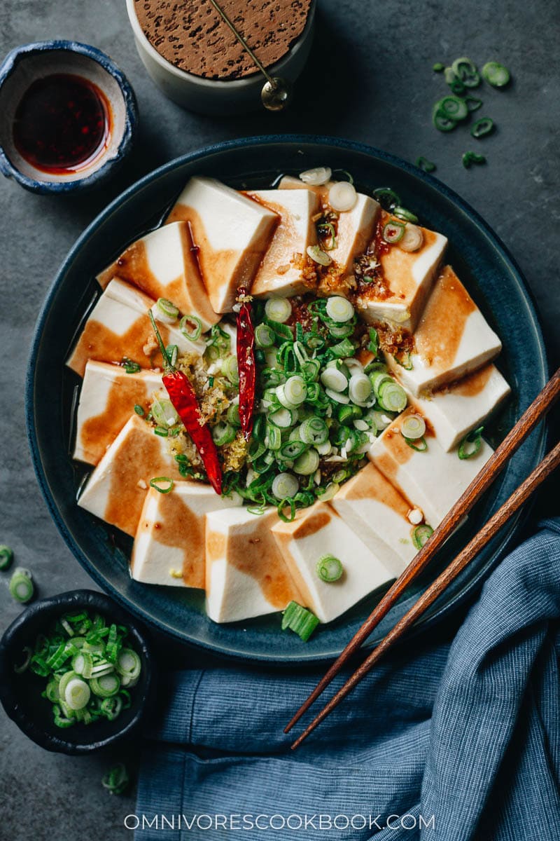 Homemade steamed tofu with sauce and green onions