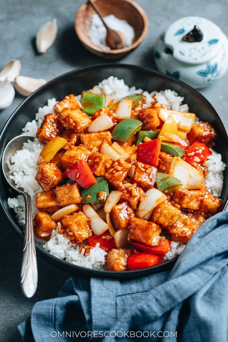Sweet and sour tofu with pepper and onion over steamed rice