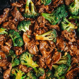 Beef and broccoli in a skillet close up