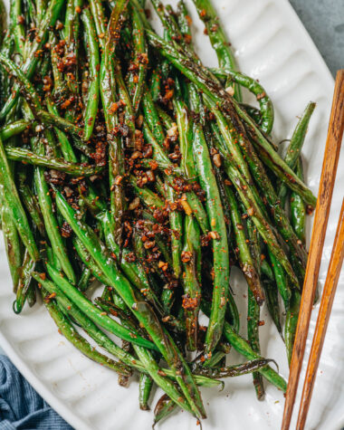 Charred and blistered green beans cooked with minced garlic