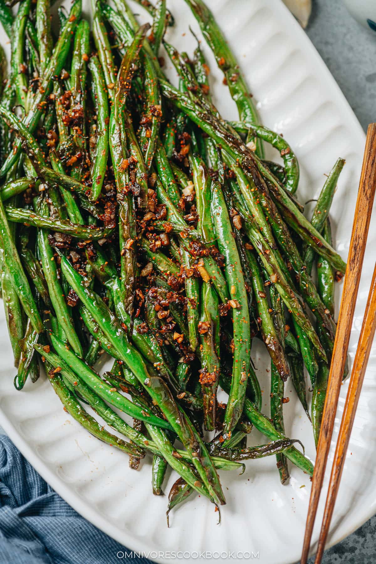 Charred and blistered green beans cooked with minced garlic