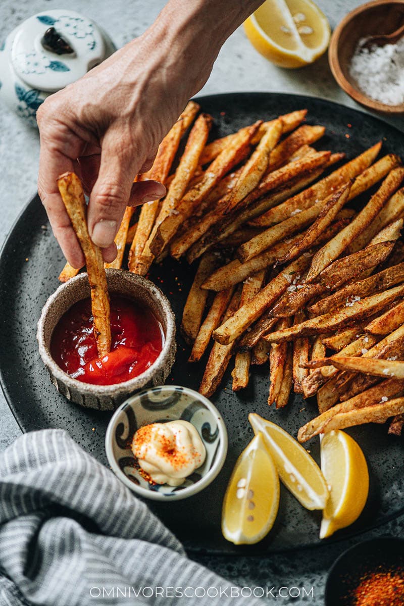 Dipping air fryer fries into ketchup