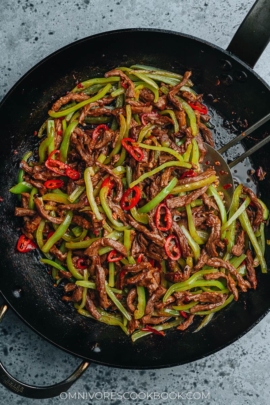 Chinese shredded beef and pepper stir fry in a pan