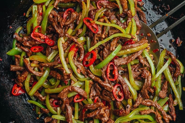 Chinese shredded beef and pepper stir fry in a pan