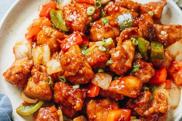 Sweet and sour chicken with pepper and onion