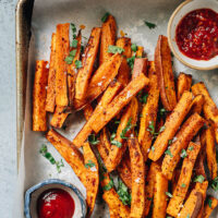 A super easy air fryer sweet potato fries recipe featuring perfectly cooked fries that are crispy on the outside, tender inside, and enhanced with a savory spice mix. It requires less oil than deep frying and tastes so good! {Vegan, Gluten-Free}