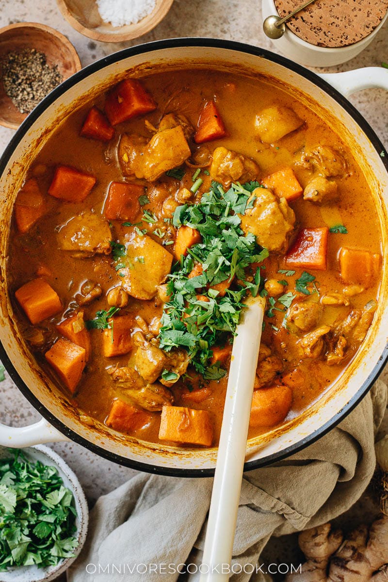 Chicken sweet potato curry in a pot close up