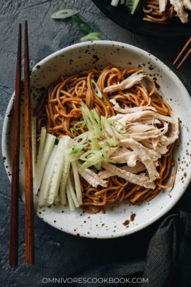 Chinese chicken noodle salad garnished with cucumber