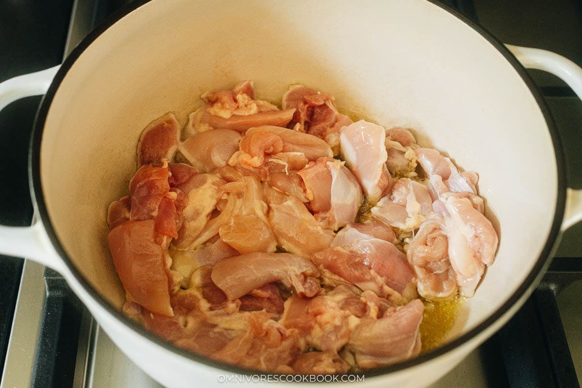 Brown the chicken in a pot