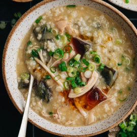 Homemade century egg congee with chicken topped with fried shallot