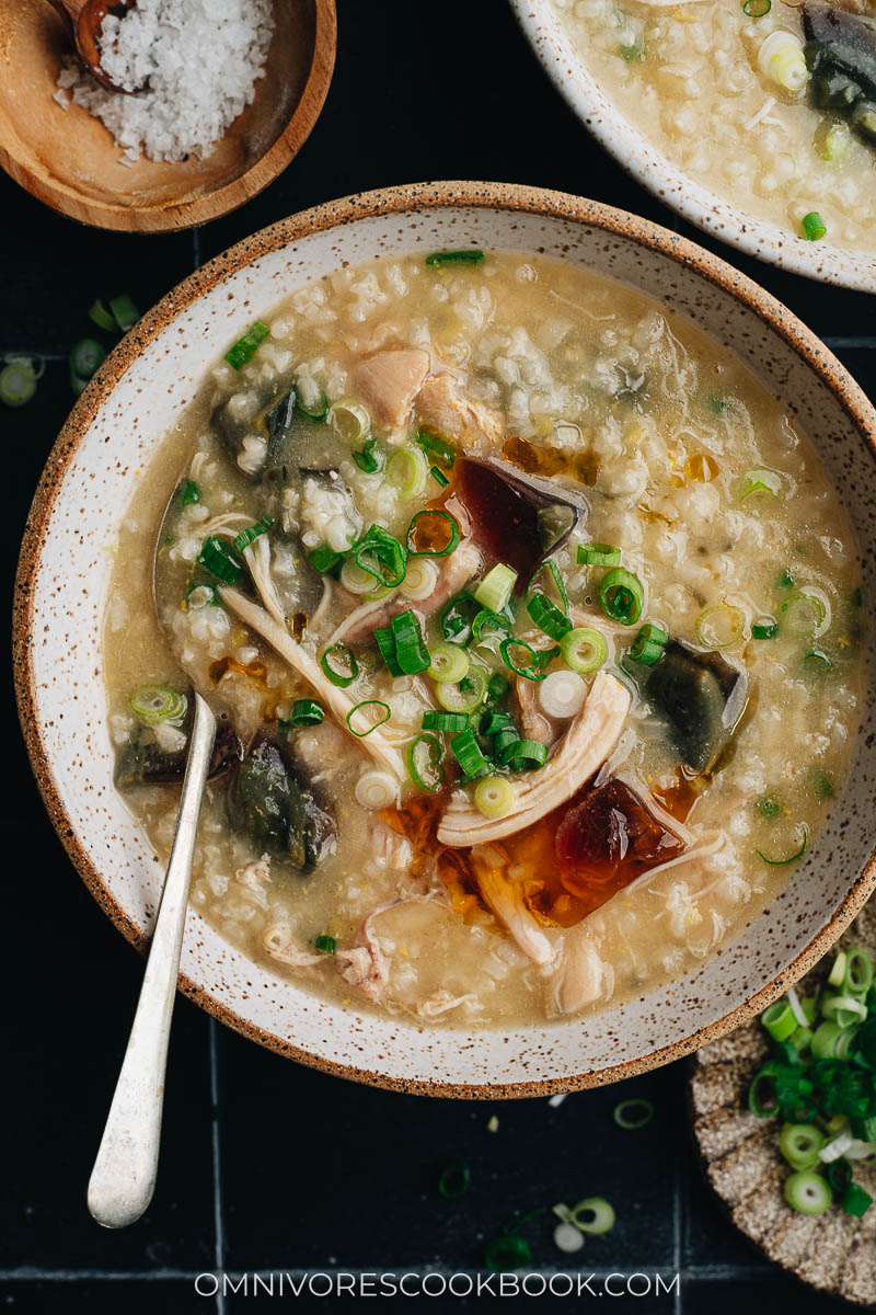 Homemade century egg congee with chicken topped with fried shallot