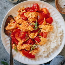 Tender tomatoes and scrambled eggs are stir fried with aromatics and very simple seasonings and served with rice. It’s a super hearty and healthy meal that takes 10 minutes to throw together and it tastes so satisfying. {Vegetarian, Gluten-Free}