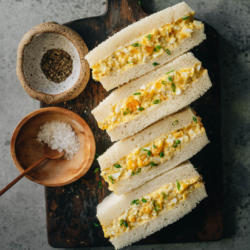 Japanese egg sandwich, or tamago sando, features creamy egg salad packed between light and fluffy Japanese milk bread. It is so easy to put together and holds up well, so it’s perfect for a light meal or wrapped up for your kid’s lunchbox.
