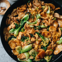 Rice Cake Stir Fry (炒年糕, Chao Nian Gao) is a Shanghainese classic dish that combines chewy, gooey rice cake with chicken, bok choy, and egg in a tasty brown sauce. This one-dish meal has some really fun textures and the flavors are instantly familiar. {Gluten-Free Adaptable}