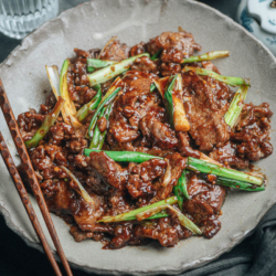 This easy Mongolian beef recipe features beautifully caramelized beef with a juicy, tender texture. And a gingery, garlicky, sweet and savory sauce makes this dish irresistible! You won’t believe how easy it is to make this restaurant-style stir fry in your own kitchen without a wok! {Gluten-Free adaptable}