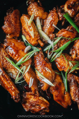 Coca-Cola chicken wings in a pan close up