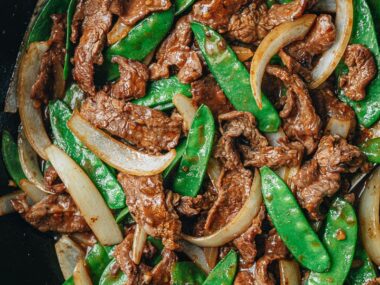 Beef with snow peas close up