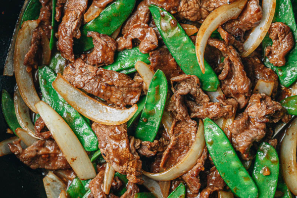 Beef with snow peas close up
