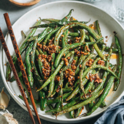 This air fryer garlic green beans recipe features blistered green beans cooked with a bold and savory garlic sauce. It uses less than 5 ingredients and takes less than 10 minutes to put together, so it’s a perfect quick side dish for your dinner. {Vegan, Gluten-Free Adaptable}