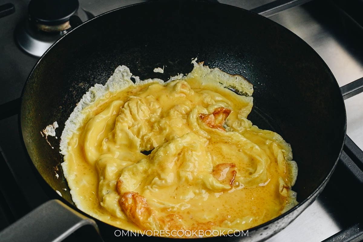 Scramble eggs in a pan