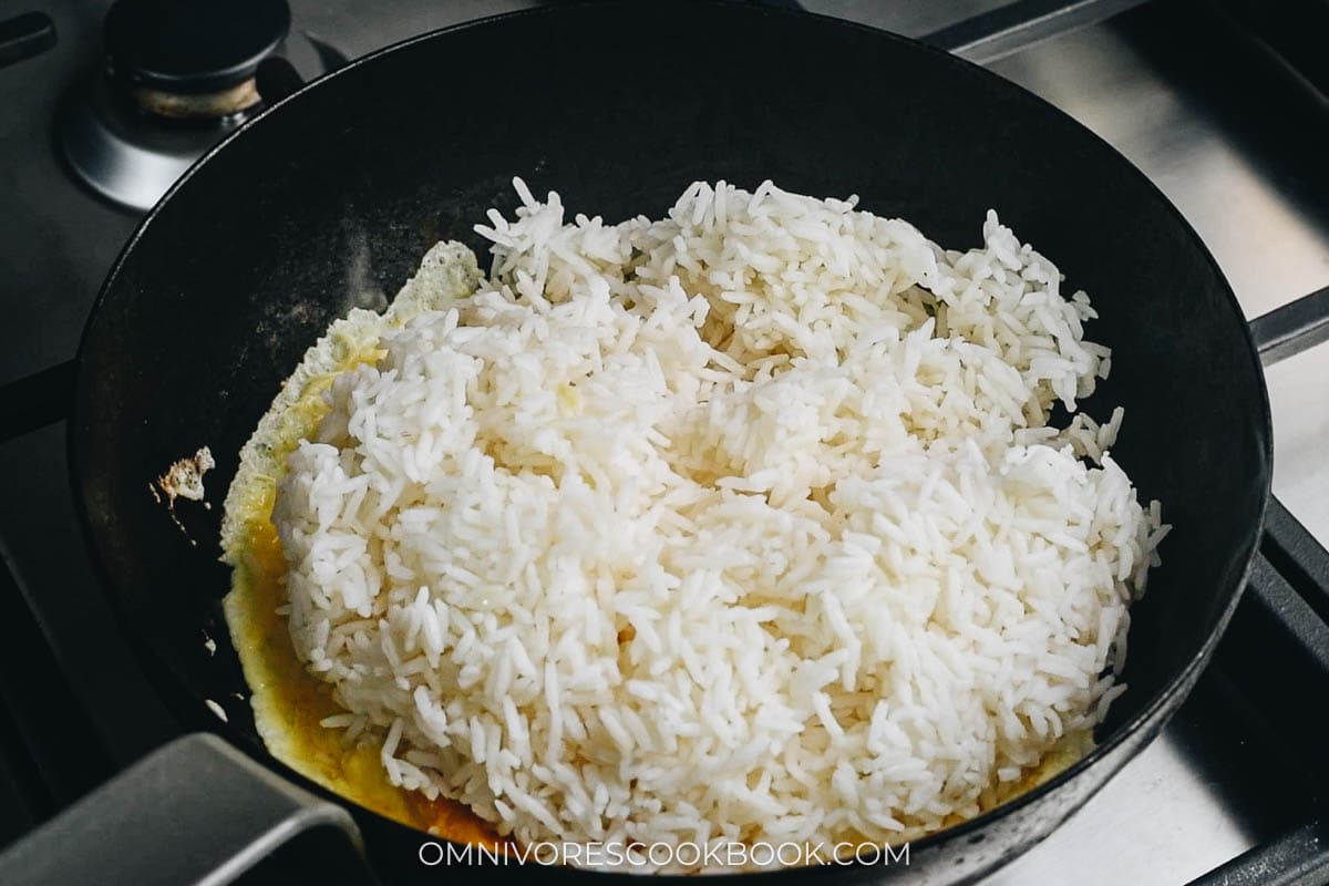 Add rice onto the eggs