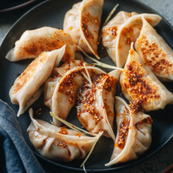 Crispy Chinese chicken dumplings feature a juicy ground chicken filling and are loaded with vegetables. Not only for celebrating Chinese New Year and other festivals, these dumplings are a great weekday snack because you can make them ahead and they freeze well.