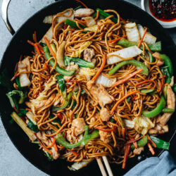 This chicken lo mein recipe yields juicy chicken, crisp peppers, tender napa cabbage, and thick, chewy noodles tossed in a rich savory brown sauce that is extra fragrant. Make your favorite Chinese takeout dish without a wok and it will taste just as great as the restaurant version!