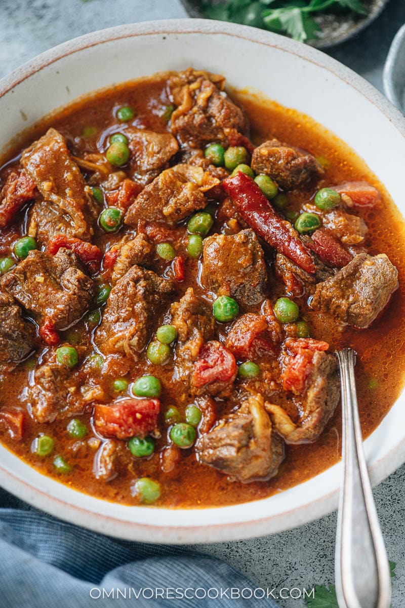Instant Pot curry beef stew with green peas in a tomato sauce