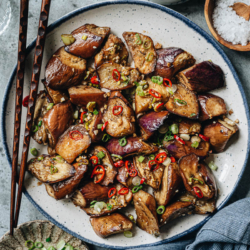 This Chinese style air fryer eggplant features tender eggplant with crispy charred edges, tossed in a light garlic sauce to further enhance the flavor. It is super easy to put together and fast to cook, making it a perfect side dish for your weekday dinner. {Gluten-Free Adaptable, Vegan}
