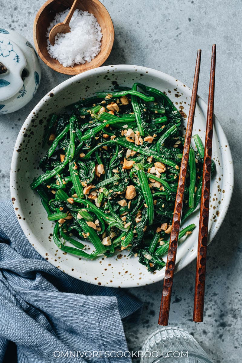 Chinese spinach salad with peanuts served in a bowl