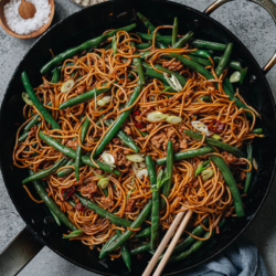 Green bean noodles is a great one-bowl meal featuring chewy noodles and tender green beans brought together with a savory brown sauce that is super fragrant. It is a hearty main that will bring you comfort at any time of day.