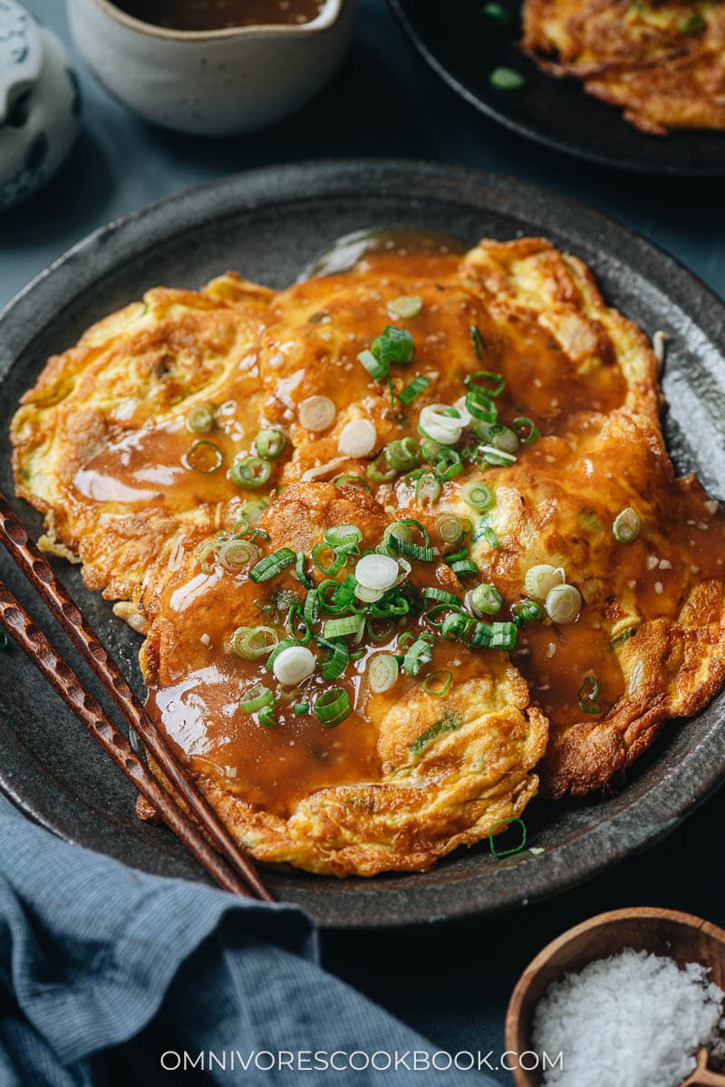 Chicken egg foo young topped with gravy and green onion