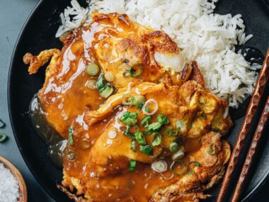 Chinese omelet over white rice with gravy