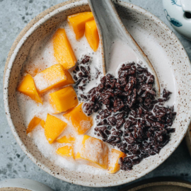 Black rice pudding with coconut milk close up
