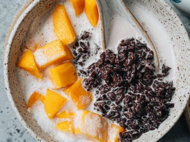 Black rice pudding with coconut milk close up