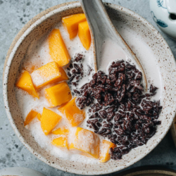 Black rice pudding is a healthy dessert made from ingredients you wouldn’t expect! Gooey rice soaked in sweetened coconut milk and paired with fresh summer fruit is a tantalizing treat that will refresh you on the hottest days! {Gluten-Free, Vegan}