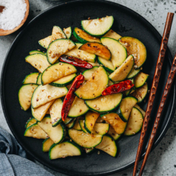 My Chinese zucchini stir fry is a fantastic homestyle dish that is quite simple to make. The summer squash is sauteed in Sichuan peppercorn oil to add a bold, vibrant flavor that makes the zucchini really come alive. {Gluten-Free Adaptable, Vegan}