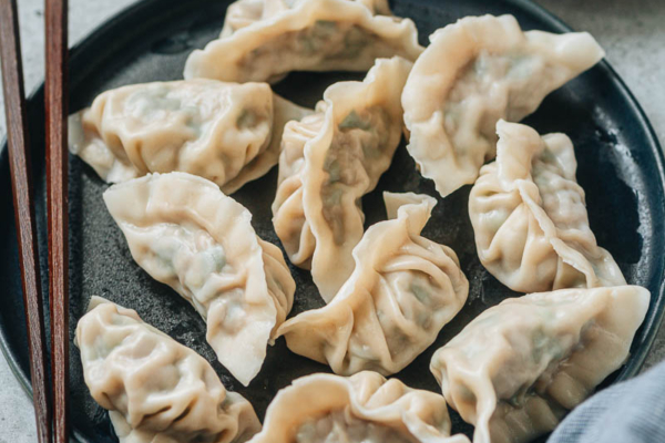 Boiled pork and chive dumplings close up
