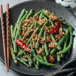 Sichuan dry fried green beans feature blistered green beans tossed with a savory aromatic sauce, making this dish too good to pass up! It’s an addictive side dish and substantial enough to serve as a main. {Vegan Adaptable, Gluten Free Adaptable}
