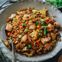 For a super fast and delicious dinner, my chicken fried rice is here for you, full-flavored and quicker than any delivery! The crispy rice is mixed with tender juicy chicken, crunchy veggies, and a savory sauce that tastes even better than the Chinese restaurant version.