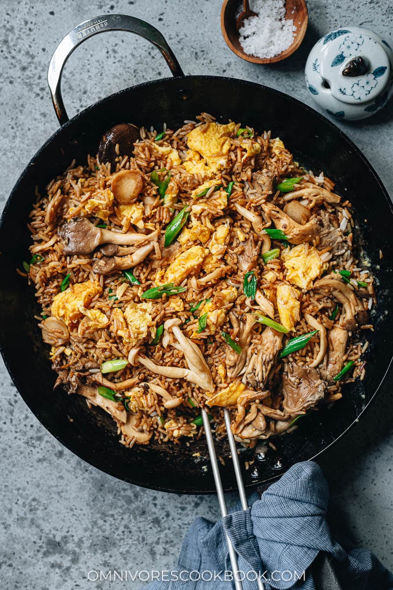 Fried rice with mushroom and eggs in a pan