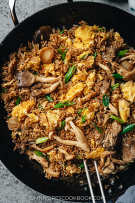 Mushroom fried rice in a pan close up