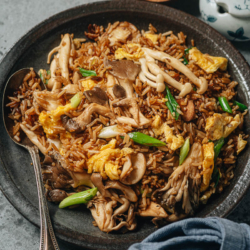Mushroom rice is a super quick and satisfying side that can be served as a light main dish as well. Assorted mushrooms are seared and stir fried with crispy rice and brought together with a savory and aromatic sauce. Make this for your lunch, meal-prep, or a dinner course. {Gluten-Free Adaptable, Vegetarian}