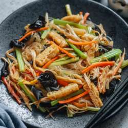 A colorful Chinese style detox stir fry that features crisp celery, flavorful fried tofu, crunchy mushrooms and tender glass noodles stir fried together with a savory sauce. It is a satisfying vegetarian dish that is super nutritious and filling. {Vegan, Gluten-Free Adaptable}