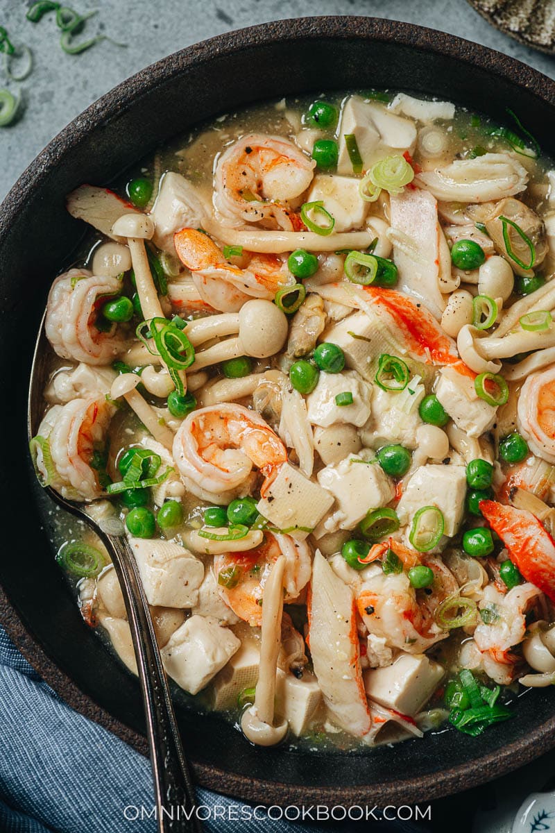 Chinese style seafood tofu stew with shrimp, clams and mushrooms