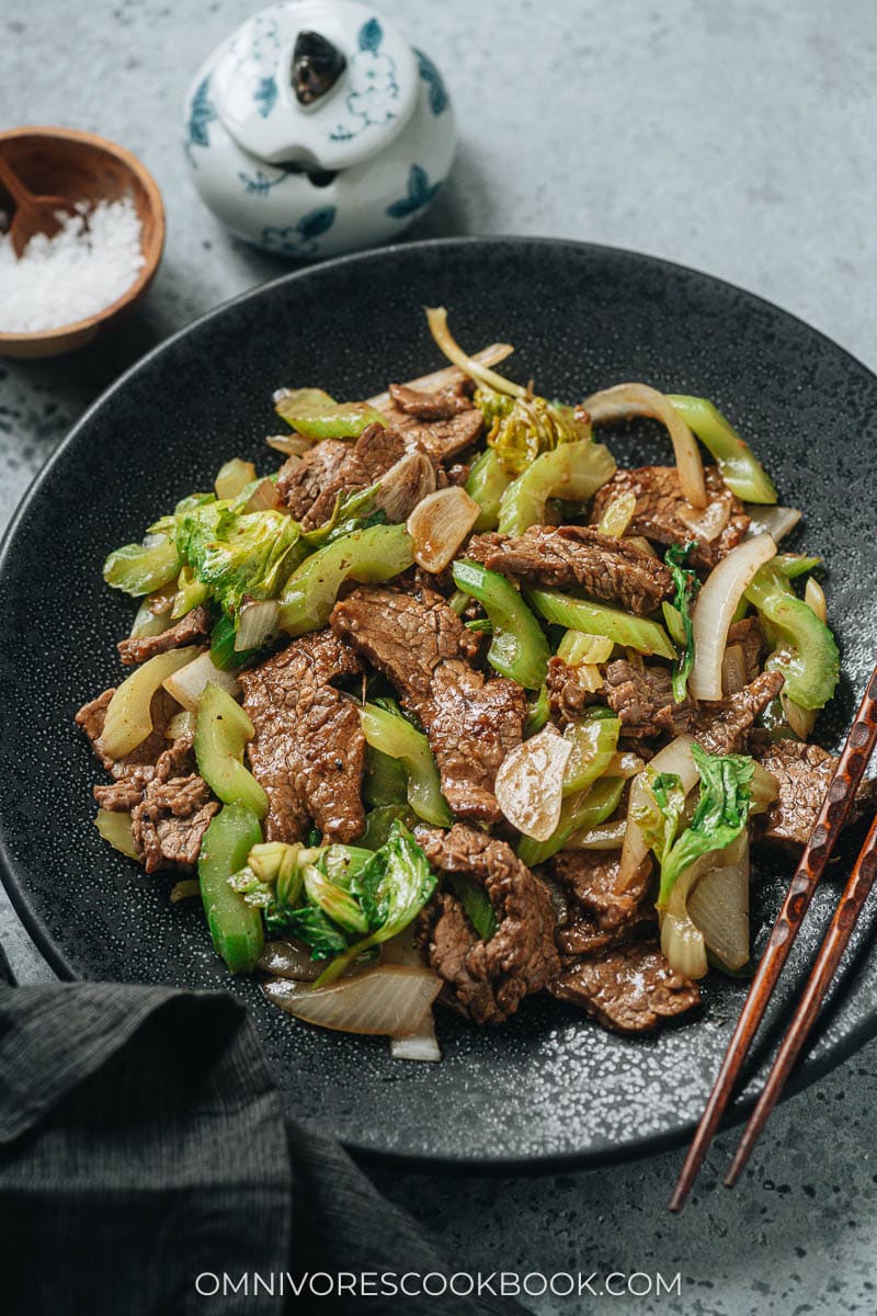 Beef and celery stir fry served in a plate close up