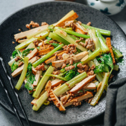 Dried tofu and celery stir fry is a satisfying and healthy main dish that you can put together in no time. The crunchy celery and chewy smoked tofu are cooked with a small amount of ground pork to enhance their flavor, along with ginger, garlic and soy sauce. It’s super easy to make and tastes very satisfying! {Gluten-Free Adaptable, Vegetarian Adaptable}