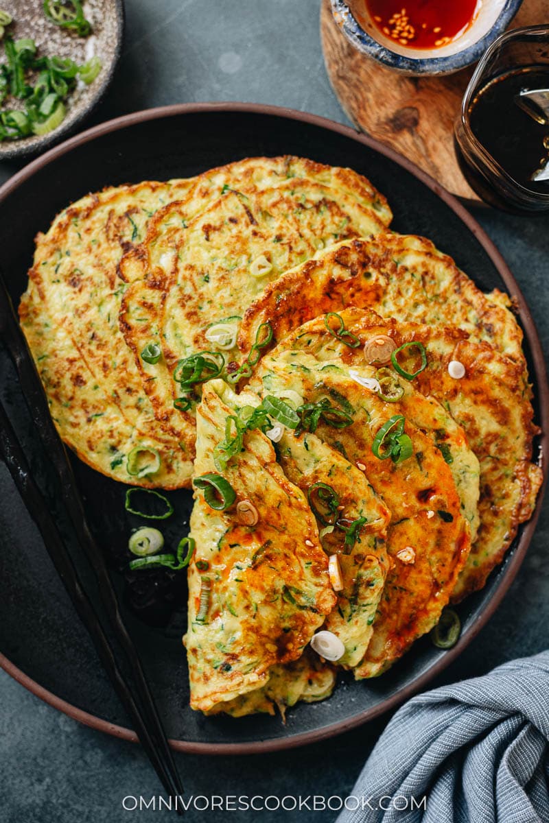 Chinese zucchini pancakes with sauce on top