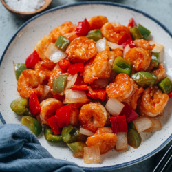 Sweet and sour shrimp is a colorful and satisfying main dish that your whole family will love! The crispy shrimp and crunchy peppers are brought together with a fragrant sweet and sour sauce. It’s easy to put together and tastes perfect over steamed rice for dinner. {Gluten-Free Adaptable}