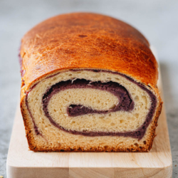 This taro bread has a light and fluffy milk bread base swirled with a lightly sweetened taro filling. Change up your regular loaf with this beautiful taro bread for a nice weekend breakfast, or make it as a special edible gift. {Vegetarian}